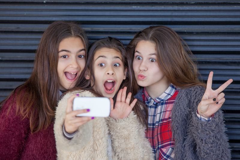 kids selfie with cell smart or mobile phone
